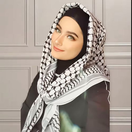 beatiful woman wearing Palestinian keffiyeh scarf showcasing classic authentic palestine patterns, symbolizing palestinian cultural heritage and resistance arab headscarf for men and women