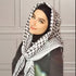 beatiful woman wearing Palestinian keffiyeh scarf showcasing classic authentic palestine patterns, symbolizing palestinian cultural heritage and resistance arab headscarf for men and women