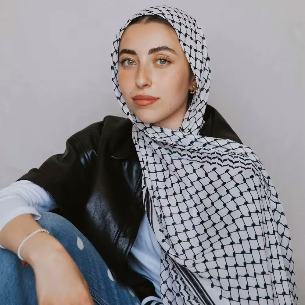 beatiful woman wearing Palestinian keffiyeh scarf showcasing classic authentic palestine patterns, symbolizing palestinian cultural heritage and resistance arab headscarf for men and women