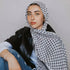 beatiful woman wearing Palestinian keffiyeh scarf showcasing classic authentic palestine patterns, symbolizing palestinian cultural heritage and resistance arab headscarf for men and women